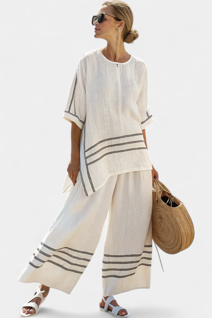 Vittorina – top asymétrique à rayures sophistiqué et pantalons audacieux