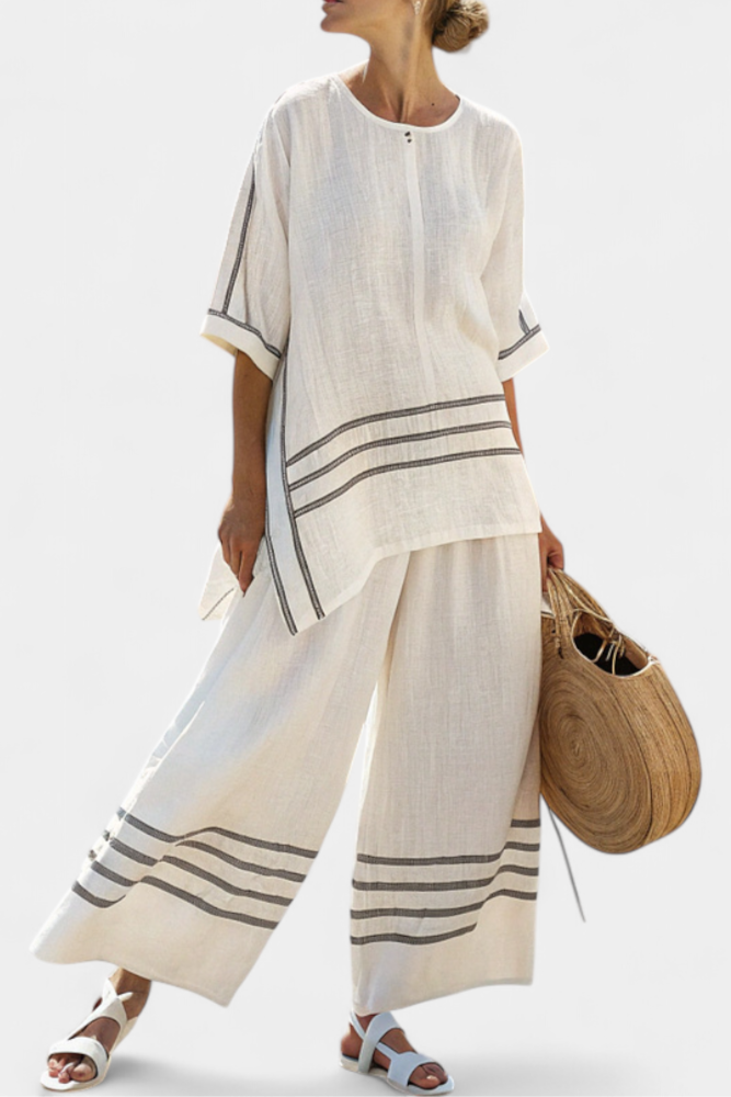Vittorina – top asymétrique à rayures sophistiqué et pantalons audacieux