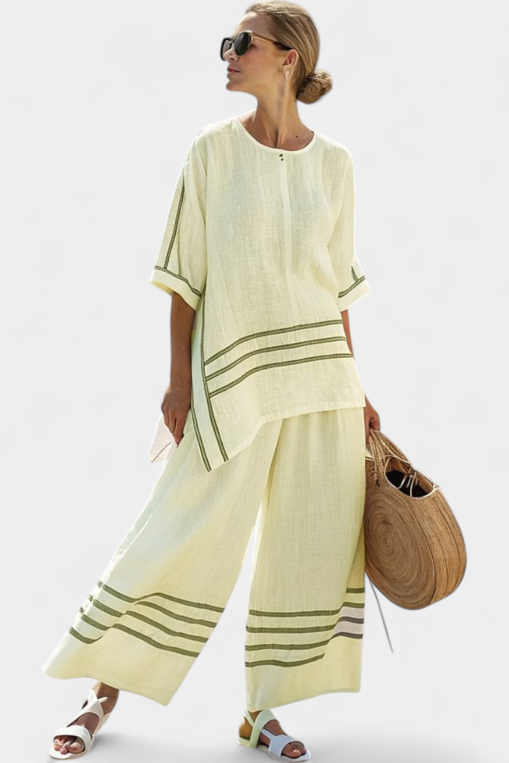 Vittorina – top asymétrique à rayures sophistiqué et pantalons audacieux
